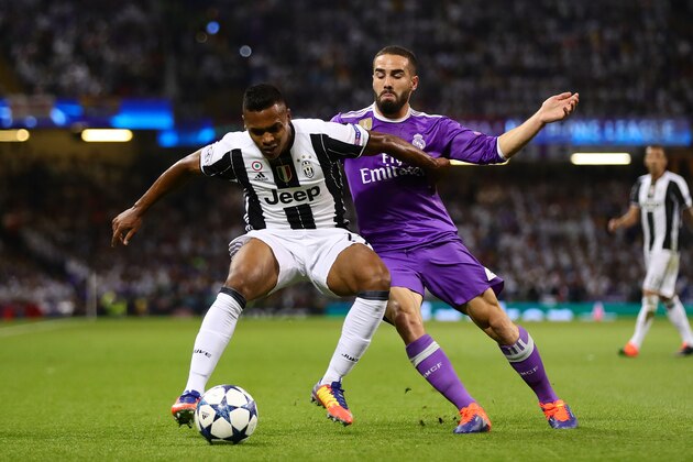 CARDIFF, WALES - JUNE 03: Alex Sandro of Juventus in action with Dani Carvajal of Real Madrid during the UEFA Champions League Final match between Juventus and Real Madrid at the National Stadium of Wales on June 3, 2017 in Cardiff, Wales. (Photo by Chris Brunskill Ltd/Getty Images)
