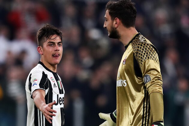 TURIN, ITALY - MARCH 10: Paulo Dybala of Juventus FC offers his hand to Gianluigi Donnarumma of AC Milan at the end of the Serie A match between Juventus FC and AC Milan at Juventus Stadium on March 10, 2017 in Turin, Italy.  (Photo by Chris Brunskill Ltd/Getty Images)