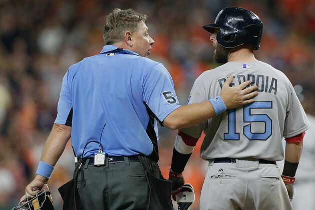 HOUSTON, TX - JUNE 18:  Home plate umpire Greg Gibson #53 talks with Dustin Pedroia #15 of the Boston Red Sox after he was hit by a pitch in the seventh inning against the Houston Astros at Minute Maid Park on June 18, 2017 in Houston, Texas.  (Photo by Bob Levey/Getty Images)