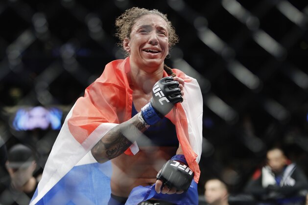 Germaine de Randamie, of the Netherlands, reacts to the decision after a women's featherweight championship mixed martial arts bout against Holly Holm at UFC 208 early Sunday, Feb. 12, 2017, in New York. De Randamie won the fight. (AP Photo/Frank Franklin II)