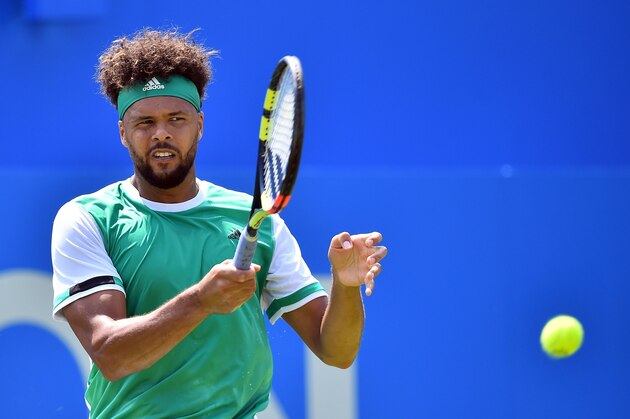France's Jo-Wilfried Tsonga returns against France's Adrian Mannarino in their men's singles 1st round match at the ATP Aegon Championships tennis tournament at Queen's Club in west London on June 19, 2017. 
Jo-Wilfried Tsonga got back on track after his French Open nightmare as the world number 10 eased into the Queen's Club second round with a 6-2, 6-2 win over Adrian Mannarino. / AFP PHOTO / GLYN KIRK        (Photo credit should read GLYN KIRK/AFP/Getty Images)