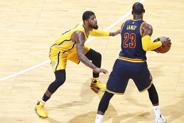 INDIANAPOLIS, IN - APRIL 20: Paul George #13 of the Indiana Pacers defends against LeBron James #23 of the Cleveland Cavaliers in game three of the Eastern Conference Quarterfinals during the 2017 NBA Playoffs at Bankers Life Fieldhouse on April 20, 2017 in Indianapolis, Indiana. The Cavaliers defeated the Pacers 119-114 to take a 3-0 lead in the series. NOTE TO USER: User expressly acknowledges and agrees that, by downloading and or using the photograph, User is consenting to the terms and conditions of the Getty Images License Agreement. (Photo by Joe Robbins/Getty Images)