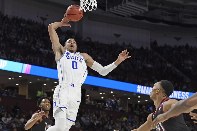 Duke's Jayson Tatum (0) goes to the basket against Troy during the first half in a first-round game of the NCAA men's college basketball tournament in Greenville, S.C., Friday, March 17, 2017. (AP Photo/Rainier Ehrhardt)