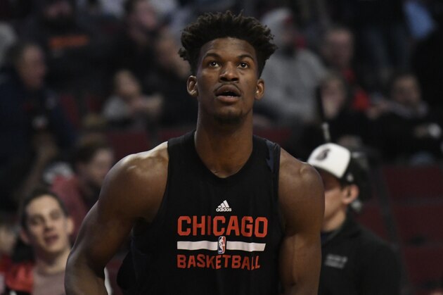 Chicago Bulls forward Jimmy Butler (21) warms up before the start of the game against the Miami Heat during an NBA basketball game in Chicago, Friday, Jan. 27, 2017. Butler was taken out of the starting lineup for comments he made after a loss, (AP Photo/David Banks)