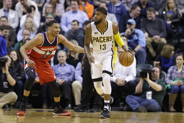 Washington Wizards forward Otto Porter Jr. (22) defends Indiana Pacers forward Paul George (13) during the first half of an NBA basketball game in Indianapolis, Thursday, Feb. 16, 2017. (AP Photo/Michael Conroy)