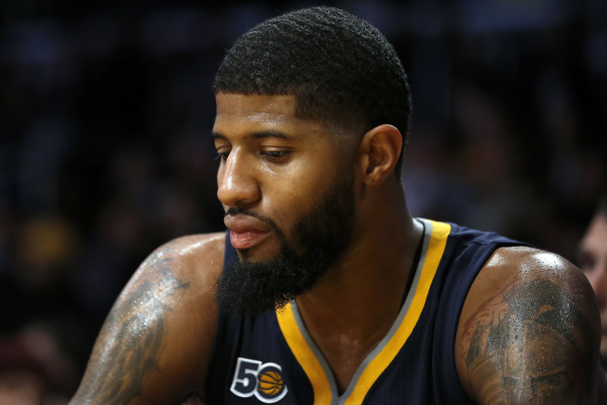 Indiana Pacers forward Paul George sits on the bench during the second half of an NBA basketball game against the Los Angeles Lakers in Los Angeles, Friday, Jan. 20, 2017. (AP Photo/Alex Gallardo)