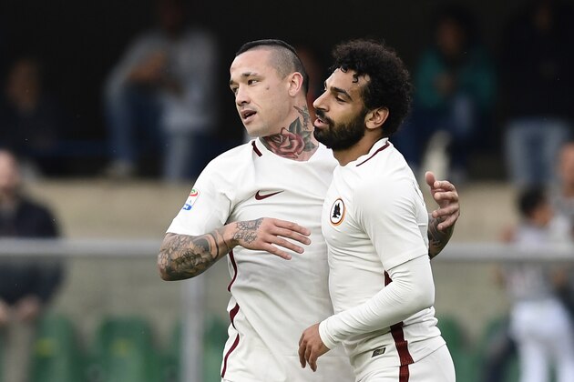 AS Roma's Egyptian midfielder Mohamed Salah (R) celebrates with AS Roma's Belgium midfielder Radja Nainggolan after scoring during the Italian Serie A football match Chievo vs AS Roma at the Marcantonio Bentegodi stadium in  Verona on Mai 20, 2017. / AFP PHOTO / MIGUEL MEDINA        (Photo credit should read MIGUEL MEDINA/AFP/Getty Images)