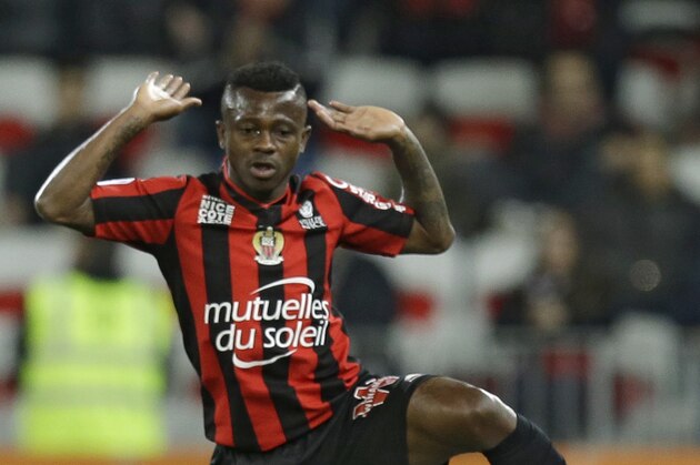 Nice's Jean Michael Seri, left, gestures infant of Troyes's Jessy Pi during their French League One soccer match, Saturday, March 5, 2016, in Nice stadium, southeastern France. (AP Photo/Lionel Cironneau)