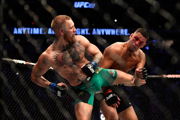 LAS VEGAS, NV - AUGUST 20:  (L-R) Conor McGregor of Ireland kicks Nate Diaz in their welterweight bout during the UFC 202 event at T-Mobile Arena on August 20, 2016 in Las Vegas, Nevada. (Photo by Jeff Bottari/Zuffa LLC/Zuffa LLC via Getty Images)