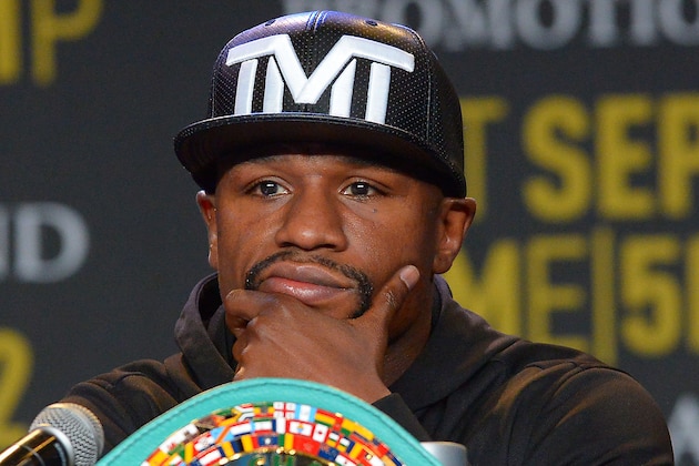 Aug 6, 2015; Los Angeles, CA, USA; Floyd Mayweather, Jr. listens during a press conference to announce the upcoming fight on September 12, 2015 at J.W. Marriott LA Live. Mandatory Credit: Jayne Kamin-Oncea-USA TODAY Sports