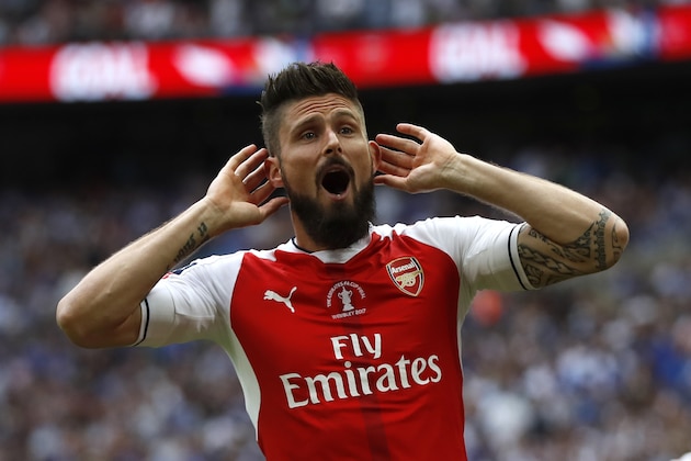 Arsenal's Olivier Giroud celebrates after Aaron Ramsey scored their side's second goal during the English FA Cup final soccer match between Arsenal and Chelsea at Wembley stadium in London, Saturday, May 27, 2017. (AP Photo/Kirsty Wigglesworth)