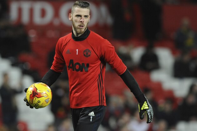 Manchester United's goalkeeper David de Gea warms up prior to the start of the the English League Cup semifinal, 1st leg, soccer match between Manchester United and Hull at Old Trafford stadium in Manchester, England, Tuesday, Jan. 10, 2017. (AP Photo/Rui Vieira)