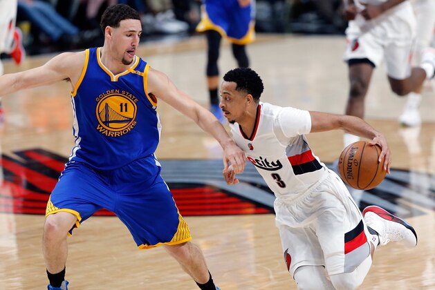 PORTLAND, OR - APRIL 22:  CJ McCollum #3 of the Portland Trail Blazers drives the ball against the Golden State Warriors  during Game Three of the Western Conference Quarterfinals of  the 2017 NBA Playoffs at Moda Center on April 22, 2017 in Portland, Oregon.  NOTE TO USER: User expressly acknowledges and agrees that, by downloading and or using this photograph, User is consenting to the terms and conditions of the Getty Images License Agreement.  (Photo by Jonathan Ferrey/Getty Images)