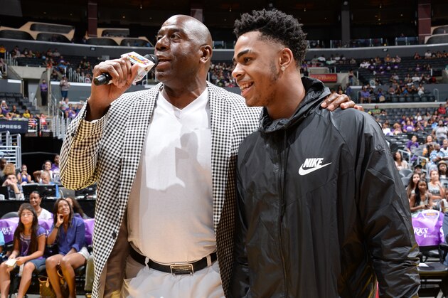 LOS ANGELES, CA - AUGUST 30: Los Angeles Sparks Owner Magic Johnson interviews D'Angelo Russell #1 of the Los Angeles Lakers during a game between the Los Angeles Sparks and the San Antonio Stars at STAPLES Center on August 30, 2015 in Los Angeles, California. NOTE TO USER: User expressly acknowledges and agrees that, by downloading and/or using this Photograph, user is consenting to the terms and conditions of the Getty Images License Agreement. Mandatory Copyright Notice: Copyright 2015 NBAE (Photo by Andrew D. Bernstein/NBAE via Getty Images)