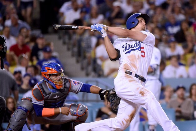LOS ANGELES, CA - JUNE 20:  Corey Seager #5 of the Los Angeles Dodgers hits a three run homerun in front of Rene Rivera #44 of the New York Mets, for his third homerun of the game, to take a 10-0 lead at Dodger Stadium on June 20, 2017 in Los Angeles, California.  (Photo by Harry How/Getty Images)