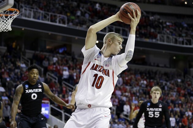 Arizona forward Lauri Markkanen (10) grabs a rebound against aXavier during the first half of an NCAA Tournament college basketball regional semifinal game Thursday, March 23, 2017, in San Jose, Calif. (AP Photo/Ben Margot)
