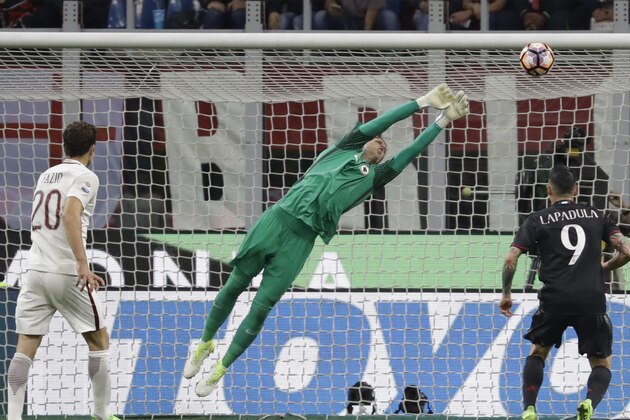 Roma goalkeeper Wojciech Szczesny saves on a shot by AC Milan's Suso during an Italian Serie A soccer match between AC Milan and Roma, at the San Siro stadium in Milan, Italy, Sunday, May 7, 2017. (AP Photo/Luca Bruno)