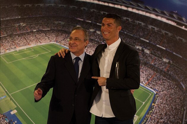 MADRID, SPAIN - NOVEMBER 07:  Cristiano Ronaldo of Real Madrid embraces club President Florentino Perez  following his press conference after signing a new five-year contract with the Spanish club at the Santiago Bernabeu stadium on November 7, 2016 in Madrid, Spain.  (Photo by Denis Doyle/Getty Images)