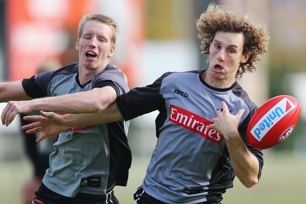 MELBOURNE, AUSTRALIA - JUNE 19:  Chris Mayne (R) competes for a mark against Josh Smith during a Collingwood Magpies AFL training session at Gosch's Paddock on June 19, 2017 in Melbourne, Australia.  (Photo by Michael Dodge/Getty Images)