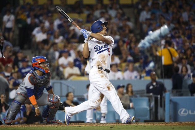 Los Angeles Dodgers' Corey Seager watches his three-run home run, his third home run of the game, during the fifth inning of a baseball game against the New York Mets, Tuesday, June 20, 2017, in Los Angeles. (AP Photo/Jae C. Hong)