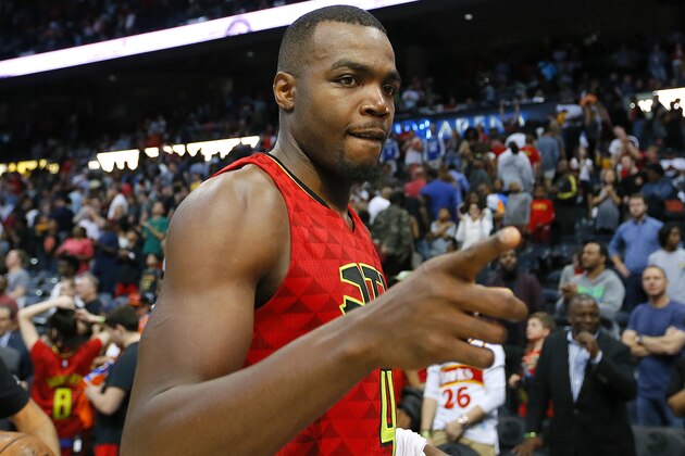 Atlanta Hawks forward Paul Millsap (4) celebrates the overtime victory as he leaves the court after an NBA basketball game against the Cleveland Cavaliers, Sunday, April 9, 2017, in Atlanta. The Hawks won in overtime 126-125. (AP Photo/Todd Kirkland)