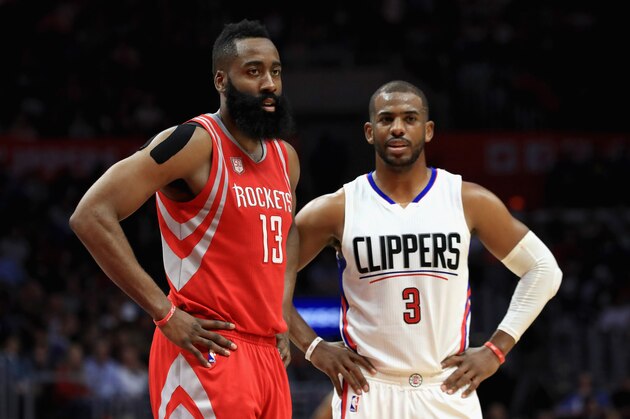 LOS ANGELES, CA - APRIL 10:  James Harden #13 of the Houston Rockets and Chris Paul #3 of the LA Clippers look on during the second  half of a game at Staples Center on April 10, 2017 in Los Angeles, California.  NOTE TO USER: User expressly acknowledges and agrees that, by downloading and or using this Photograph, user is consenting to the terms and conditions of the Getty Images License Agreement  (Photo by Sean M. Haffey/Getty Images)