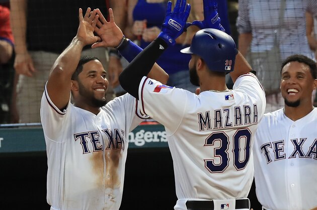 ARLINGTON, TX - JUNE 20:  Nomar Mazara #30 of the Texas Rangers celebrates his homerun with Elvis Andrus #1 of the Texas Rangers in the fifth inning against the Toronto Blue Jays at Globe Life Park in Arlington on June 20, 2017 in Arlington, Texas.  (Photo by Ronald Martinez/Getty Images)