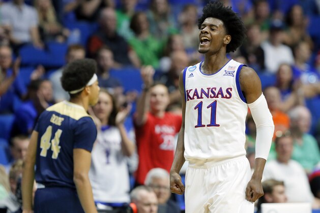Kansas's Josh Jackson (11) celebrates a basket in front of UC Davis's Garrison Goode (44) in the first half of a first-round game in the men's NCAA college basketball tournament in Tulsa, Okla., Friday March 17, 2017. (AP Photo/Tony Gutierrez)