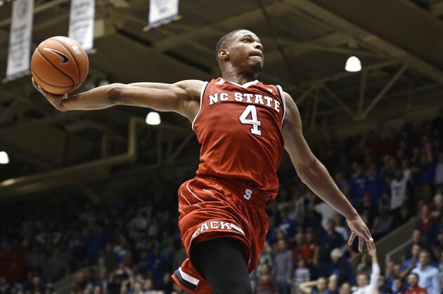 FILE - In this Jan. 23, 2017 file photo, North Carolina State's Dennis Smith Jr. (4) drives to the basket as time expires in the second half of an NCAA college basketball game against Duke in Durham, N.C. Two of the top freshmen in the Atlantic Coast Conference square off on Wednesday, Feb. 8 when Florida State's Johnathan Isaac faces N.C. State's Smith.  Eight freshmen are averaging 10 or more points per game, which could make balloting for the All-Freshman Team interesting. (AP Photo/Gerry Broome, File)