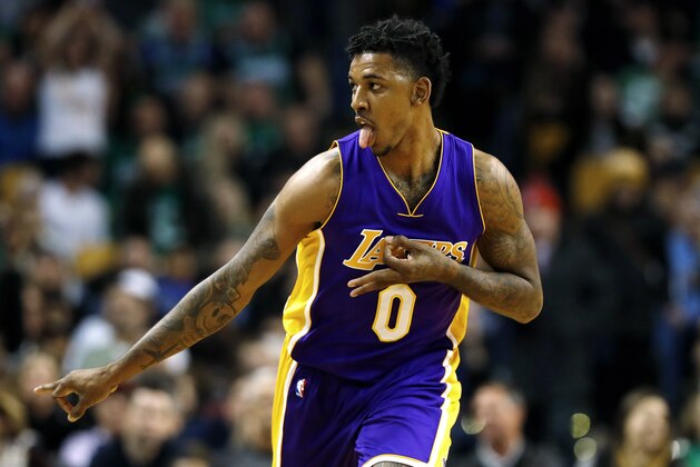 Los Angeles Lakers guard Nick Young celebrates after a three point basket against the Boston Celtics during the second quarter of an NBA basketball game in Boston Friday, Feb. 3, 2017. (AP Photo/Winslow Townson)