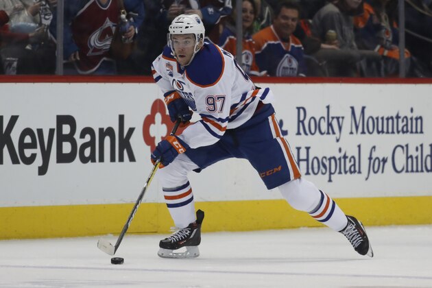 FILE - In this March 23, 2017, file photo, Edmonton Oilers center Connor McDavid (97) skates against the Colorado Avalanche in the second period of an NHL hockey game, in Denver. The significance of budding young stars Connor McDavid and Auston Matthews making their respective playoff debuts isn't lost on Wayne Gretzky. The Great One tells The Associated Press he sees parallels to the buzz in 2005 when Sidney Crosby and Alex Ovechkin entered the league.  (AP Photo/David Zalubowski, File)