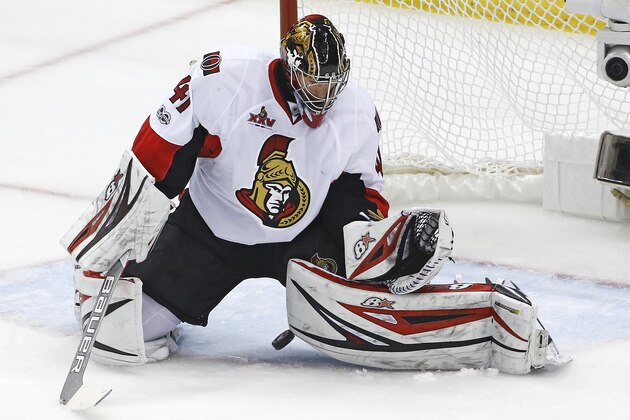 Ottawa Senators goalie Craig Anderson (41) stops a shot during the first period of Game 5 of the Eastern Conference final in the NHL Stanley Cup hockey playoffs in Pittsburgh, Sunday, May 21, 2017. The Penguins won 7-0. (AP Photo/Gene J. Puskar)