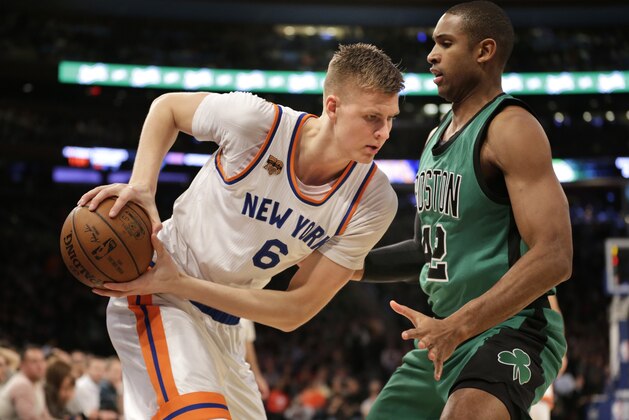 New York Knicks' Kristaps Porzingis, left, moves against Boston Celtics' Al Horford during the first half of the NBA basketball game, Sunday, April 2, 2017, in New York. (AP Photo/Seth Wenig)