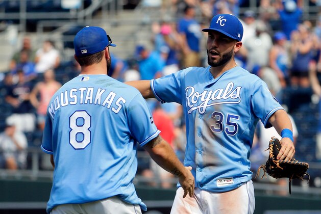 KANSAS CITY, MO - JUNE 21:  Eric Hosmer #35 and Mike Moustakas #8 of the Kansas City Royals congratulte each other after the Royals defeated the Boston Red Sox 6-4 to win the game at Kauffman Stadium on June 21, 2017 in Kansas City, Missouri.  (Photo by Jamie Squire/Getty Images)