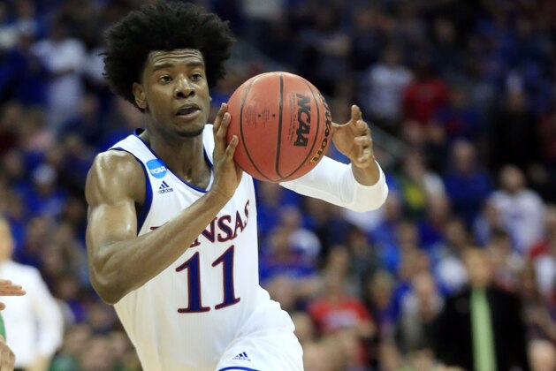 FILE - In this March 25, 2017, file photo, Kansas guard Josh Jackson pass the ball during the second half of a regional final against Oregon in the NCAA college basketball tournament in Kansas City, Mo.  The former Kansas basketball player must undergo anger management classes and apologize as part of a diversion agreement arising from a confrontation with a women's basketball player. (AP Photo/Orlin Wagner, File)