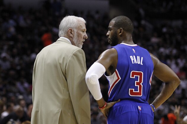 SAN ANTONIO, TX - APRIL 30: Head coach Gregg Popovich of the San Antonio Spurs and Chris Paul #3 of the Los Angeles Clippers share a moment during Game Six of the Western Conference quarterfinals of the 2015 NBA Playoffs at the AT&T Center on April 30, 2015 in San Antonio, Texas. NOTE TO USER: User expressly acknowledges and agrees that, by downloading to the terms and conditions of the Getty Images License Agreement. (Photo by Chris Covatta/Getty Images)