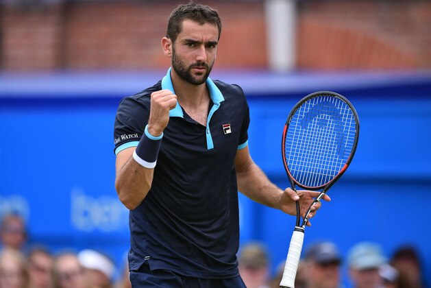 Croatia's Marin Cilic celebrates winning his men's singles second round match against Stefan Kozlov of the US at the ATP Aegon Championships tennis tournament at the Queen's Club in west London on June 22, 2017.
Marin Cilic beat Stefan Kozlov 6-0, 6-4. / AFP PHOTO / GLYN KIRK        (Photo credit should read GLYN KIRK/AFP/Getty Images)
