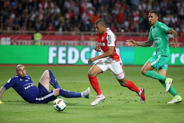 MONACO, MONACO - MAY 17: Kylian Mbappe of Monaco goes past goalkeeper of Saint-Etienne Stephane Ruffier to score his goal during the French Ligue 1 match between AS Monaco and AS Saint-Etienne (ASSE) at Stade Louis II on May 17, 2017 in Monaco, Monaco. (Photo by Jean Catuffe/Getty Images)