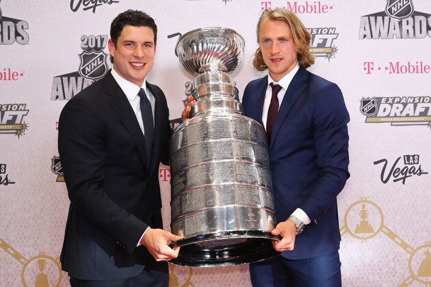 LAS VEGAS, NV - JUNE 21:  Sidney Crosby, left and Carl Hagelin of the Pittsburgh Penguins hold the Stanley Cup the 2017 NHL Awards at T-Mobile Arena on June 21, 2017 in Las Vegas, Nevada.  (Photo by Bruce Bennett/Getty Images)