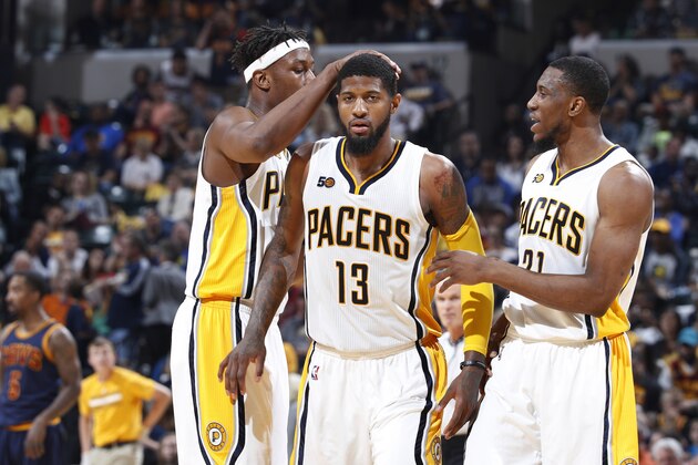 INDIANAPOLIS, IN - APRIL 23: Paul George #13 of the Indiana Pacers celebrates with Thaddeus Young #21 and Myles Turner #33 after scoring against the Cleveland Cavaliers in Game Four of the Eastern Conference Quarterfinals during the 2017 NBA Playoffs at Bankers Life Fieldhouse on April 23, 2017 in Indianapolis, Indiana. The Cavaliers defeated the Pacers 106-102 to sweep the series 4-0. NOTE TO USER: User expressly acknowledges and agrees that, by downloading and or using the photograph, User is consenting to the terms and conditions of the Getty Images License Agreement. (Photo by Joe Robbins/Getty Images)