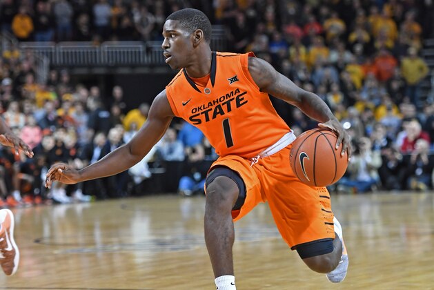 WICHITA, KS - DECEMBER 17:  Guard Jawun Evans #1 of the Oklahoma State Cowboys dribbles up court against the Wichita State Shockers during the first half on December 17, 2016 at INTRUST Bank Arena in Wichita, Kansas.  (Photo by Peter G. Aiken/Getty Images)