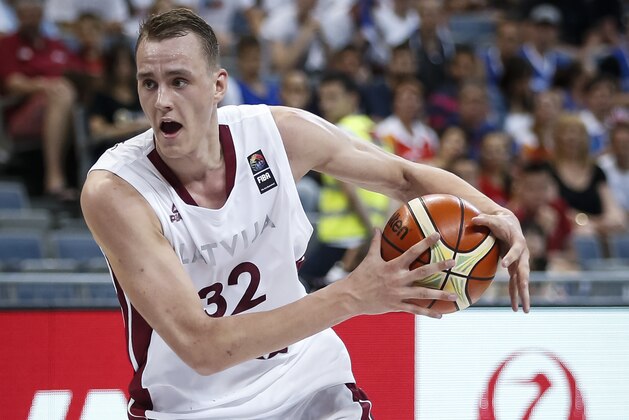 BELGRADE, SERBIA - JULY 05: Anzejs Pasecniks (R) of Latvia in action against Petr Benda (DOWN) of Czech Republic during the 2016 FIBA World Olympic Qualifying basketball Group B match between Latvia and Czech Republic at Kombank Arena on July 05, 2016 in Belgrade, Serbia. (Photo by Srdjan Stevanovic/Getty Images)