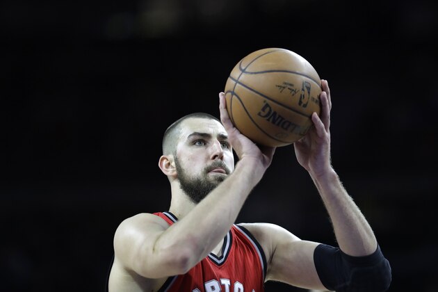 Toronto Raptors center Jonas Valanciunas shoots a free throw during the second half of an NBA basketball game against the Detroit Pistons, Wednesday, April 5, 2017, in Auburn Hills, Mich. (AP Photo/Carlos Osorio)
