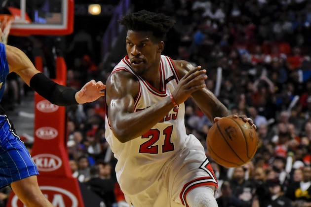 Chicago Bulls forward Jimmy Butler (21) drives against Orlando Magic guard Evan Fournier (10) during the second half of an NBA basketball game Friday, April 10, 2017, in Chicago. (AP Photo/Matt Marton)