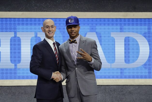 Washington's Markelle Fultz, right, poses for a photo with NBA Commissioner Adam Silver after being selected by the Philadelphia 76ers as the No. 1 pick overall during the NBA basketball draft, Thursday, June 22, 2017, in New York. (AP Photo/Frank Franklin II)