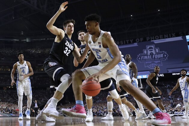 North Carolina forward Tony Bradley (5) drives past Gonzaga forward Zach Collins (32) during the second half in the finals of the Final Four NCAA college basketball tournament, Monday, April 3, 2017, in Glendale, Ariz. (AP Photo/David J. Phillip)