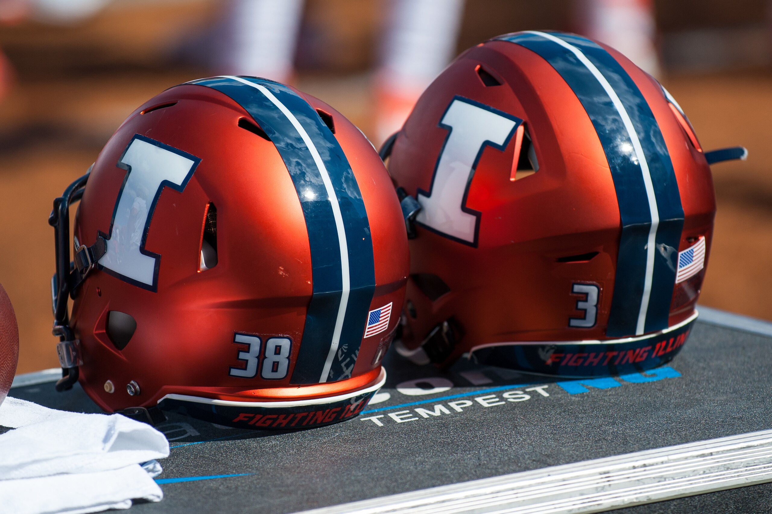 A pair of Illinois helmets sits on an equipment box during an NCAA college football game against Murray State, Saturday, Sept. 3, 2016 at Memorial Stadium in Champaign, Ill.  Illinois defeated Murray St. 52-3.  (AP Photo/Bradley Leeb)