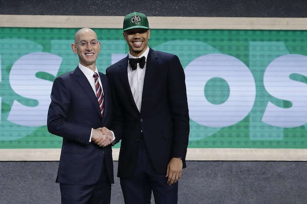 Duke's Jayson Tatum, right, poses for photos with NBA Commissioner Adam Silver after being selected by the Boston Celtics as the No. 3 pick overall during the NBA basketball draft, Thursday, June 22, 2017, in New York. (AP Photo/Frank Franklin II)