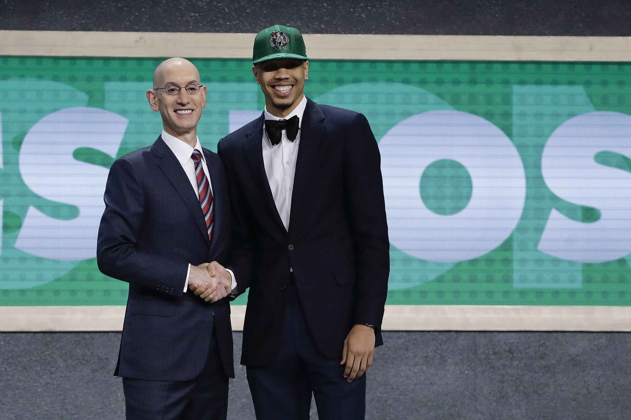 Duke's Jayson Tatum, right, poses for photos with NBA Commissioner Adam Silver after being selected by the Boston Celtics as the No. 3 pick overall during the NBA basketball draft, Thursday, June 22, 2017, in New York. (AP Photo/Frank Franklin II)