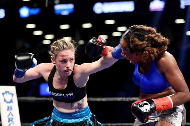 Heather Hardy, left, in action against Kirstie Simmons during their fight at the Barclays Center in Brooklyn, on Saturday, June 25, 2016. Hardy won via decision. (AP Photo/Gregory Payan)